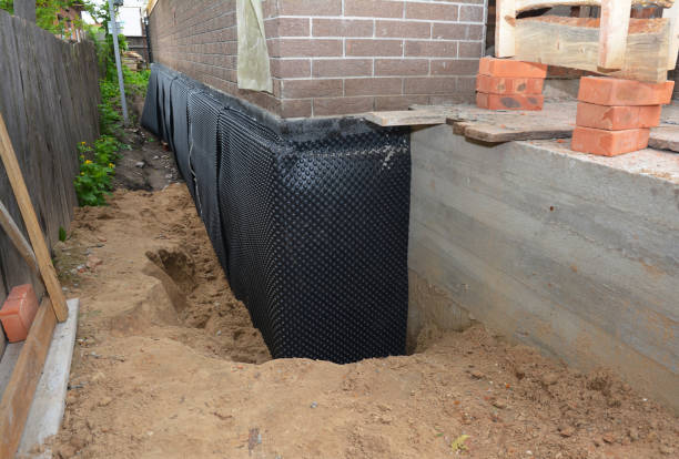SJ Waterproofing Pros technician performing targeted Waterproofing assessment in Vestaburg, MI